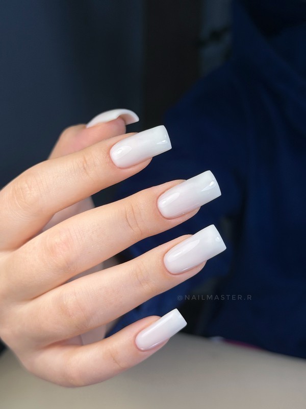 Milky manicure on medium length nails is a soft and elegant nail design that enhances natural beauty. Perfect for everyday wear and sophisticated looks.