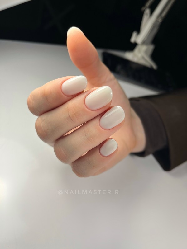 Milky white manicure on short nails is a clean and elegant design that enhances natural beauty. Perfect for everyday wear and minimalist looks.