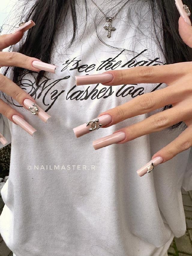 Super long nail extensions by top nail artist Daria at Evelina Beauty Studio in Dnipro Photo of super long nail extensions created by top nail artist Daria at Evelina Beauty Studio in Dnipro, Ukraine. Dramatic length, clean nail architecture and an unusual shape make this manicure style bold, elegant and eye-catching.